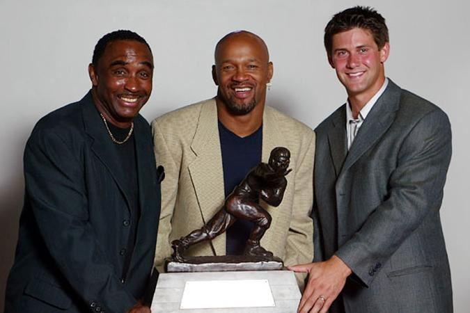 Nebraska's three Heisman winners from left to right: Johnny Rodgers (1972), Mike Rozier (1983) and Eric Crouch (2001).